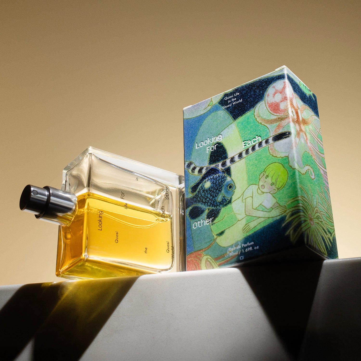 Looking For Each Other Quasi Life in the Quasi World botanical perfume bottle and illustrated box on sculptural pedestal, warm light highlighting golden natural fragrance.