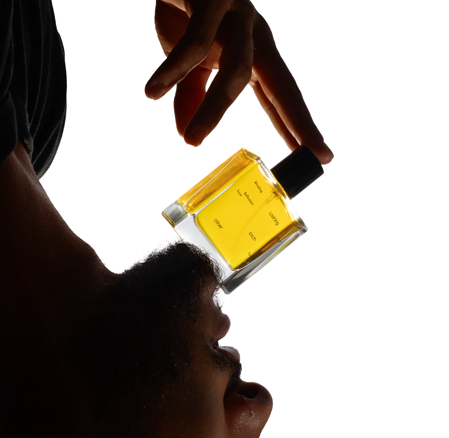 A hand holding a 50ml bottle of Blinding Reflection from Tower Window by Looking for Each Other against a white backdrop. The image highlights the brand’s minimal design and commitment to 100% botanical ingredients.